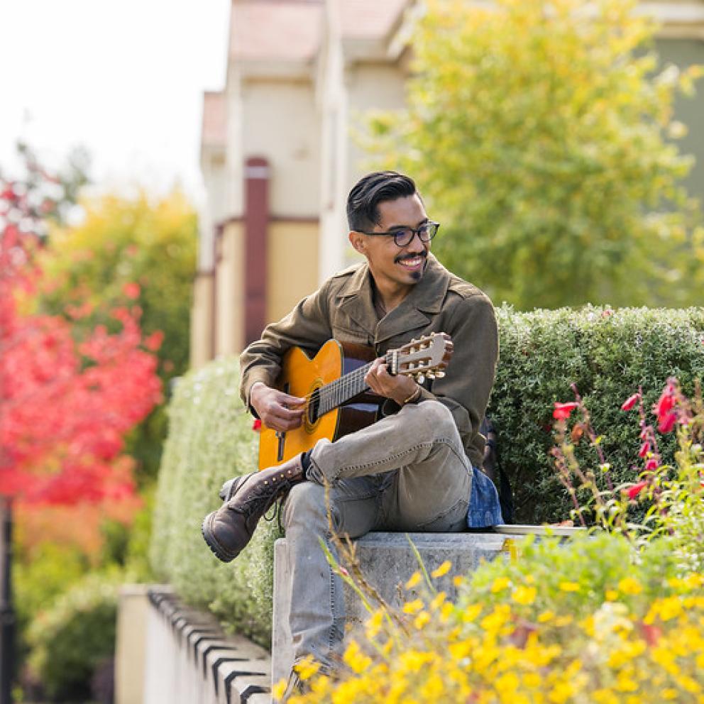 student playing guitar