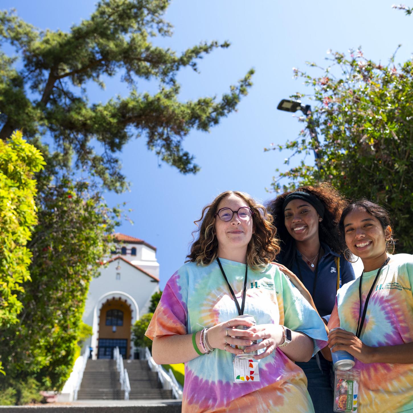 Students at the Fall 2024 Orientation smiling at the bottom of Founders Hall