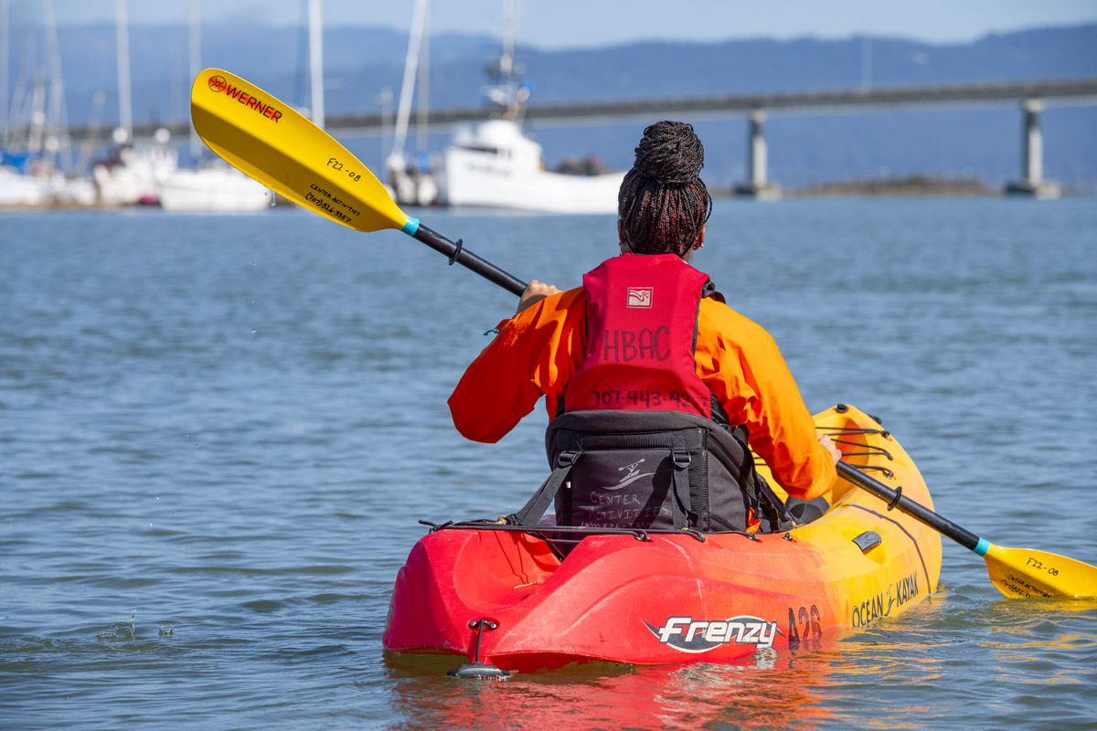 person kayaking on Humboldt Bay
