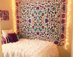 Blanket hanging on bedroom wall