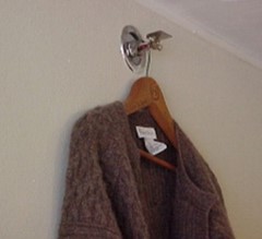 Sweater on a hanger, hanging from sprikler