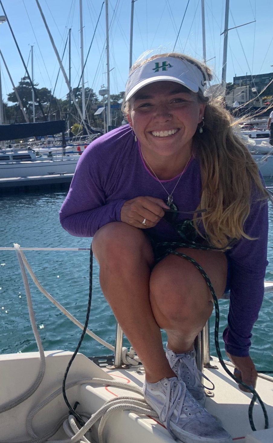 Dana smiles while on a boat.