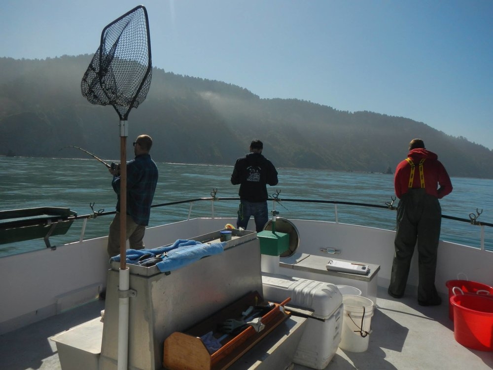 Member on boat with net