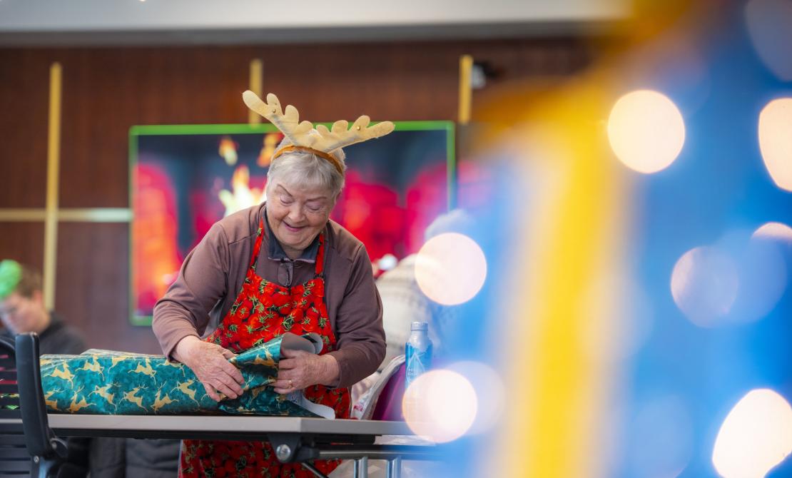 Someone wrapping a present