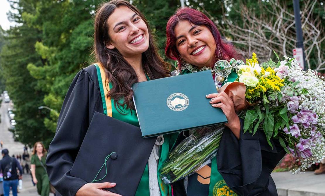 Two students are Fall Commencement 2025.