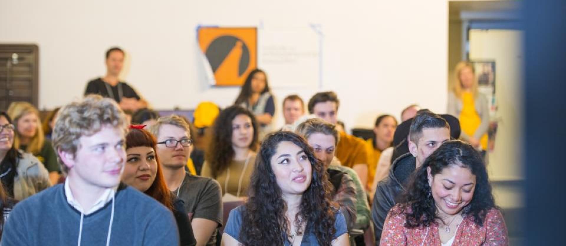 a group of students sitting in a classroom