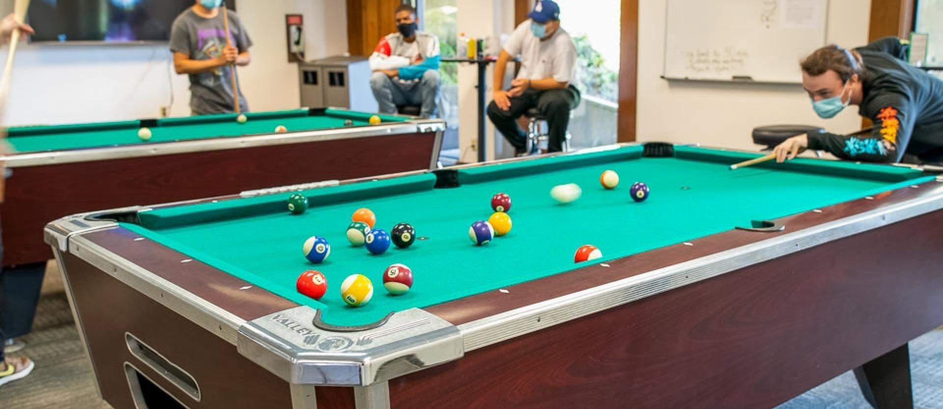 Students playing pool