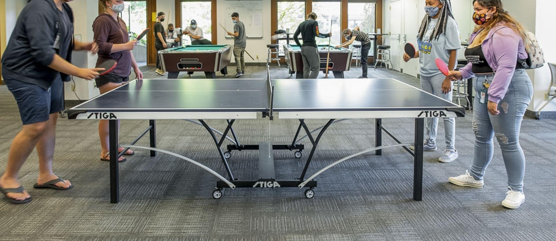 Students playing ping pong