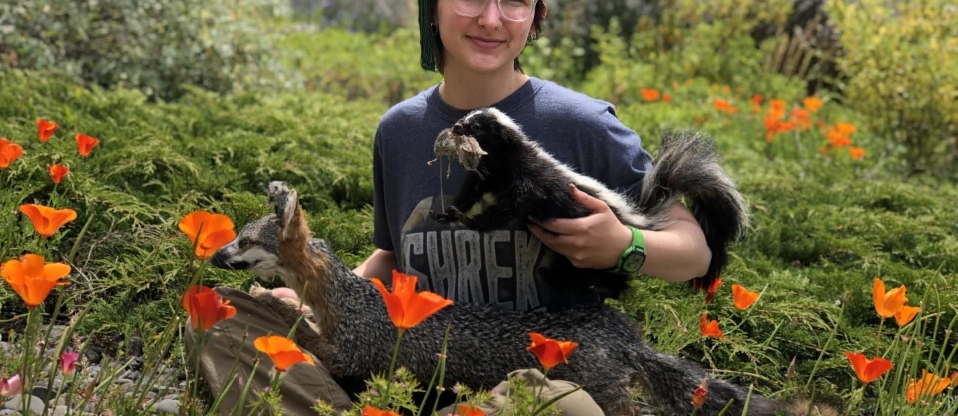 Museum student Ghennya Shain posing with her live mounts (ca. 2022).