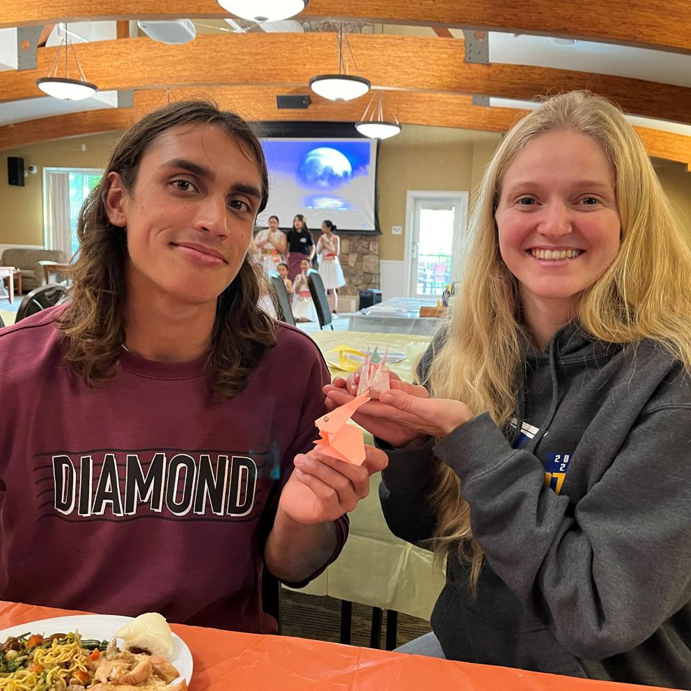 2 students showing their origamis