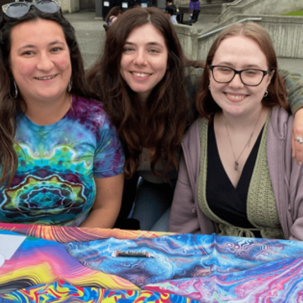 three students at a table