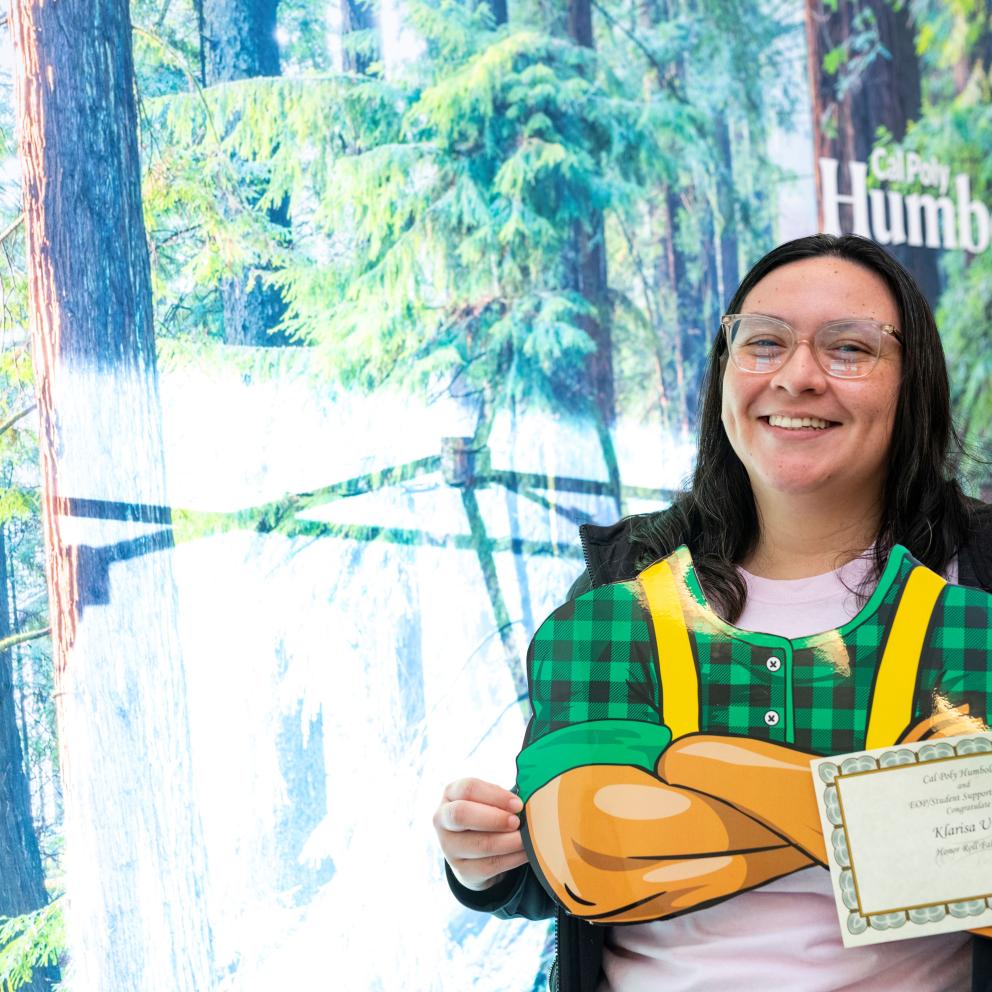 student with lumberjack arms
