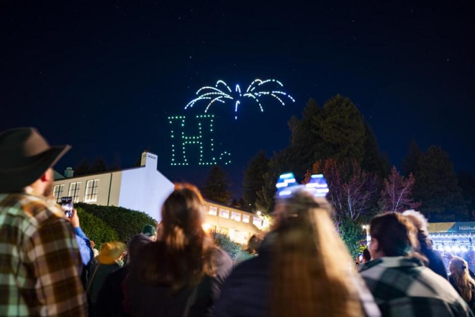 Drones align to form Cal Poly Humboldt "H." Logo with fireworks