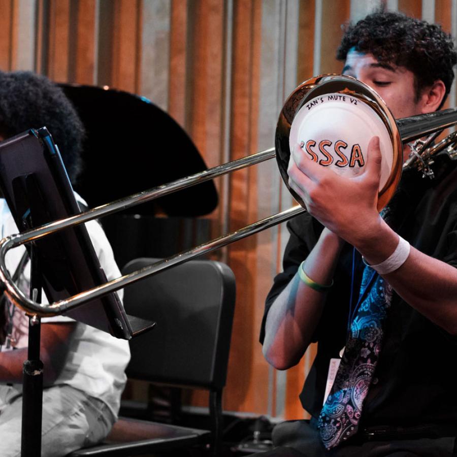 Young musicians playing guitars and trombone