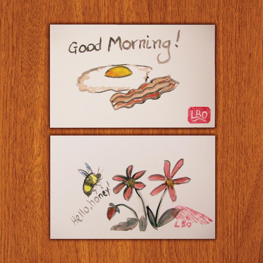 Etegami watercolored postcards: One with eggs and bacon and "Good morning!" and the other with a bumblebee and flowers, "Hello, Honey!"