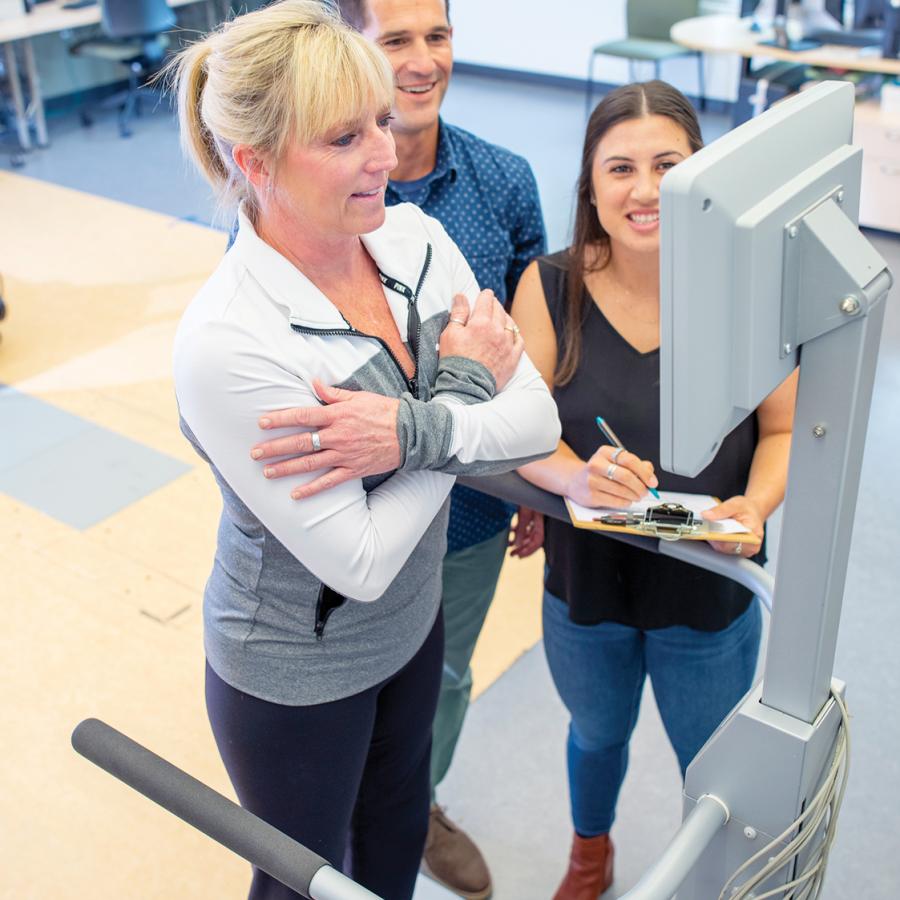 Woman getting her balance assessed at the biomechanics lab