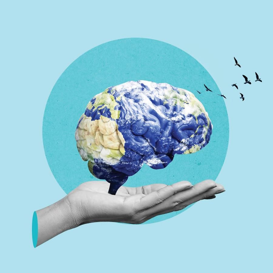 Hand holding a brain with planet Earth superimposed over it Hand holding a brain with planet Earth superimposed over it
