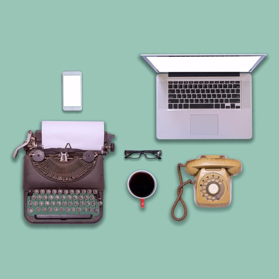Old typewriter and rotary telephone, laptop computer and smartphone Old typewriter and rotary telephone, laptop computer and smartphone