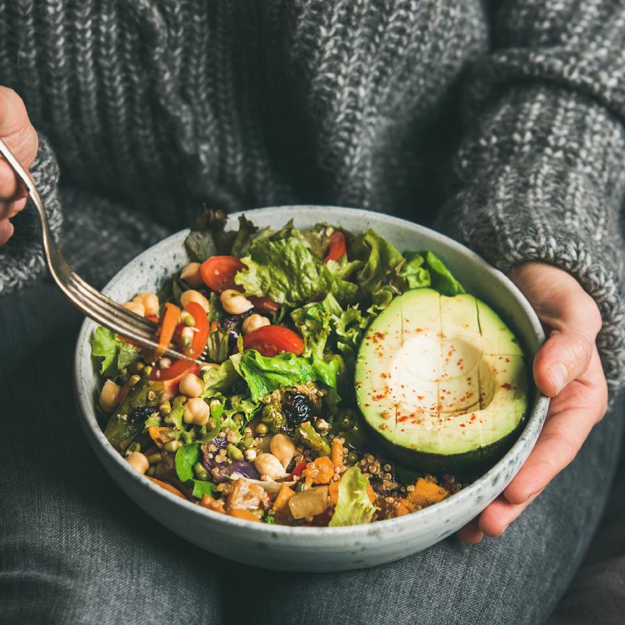 Person eating a healthy salad Person eating a healthy salad