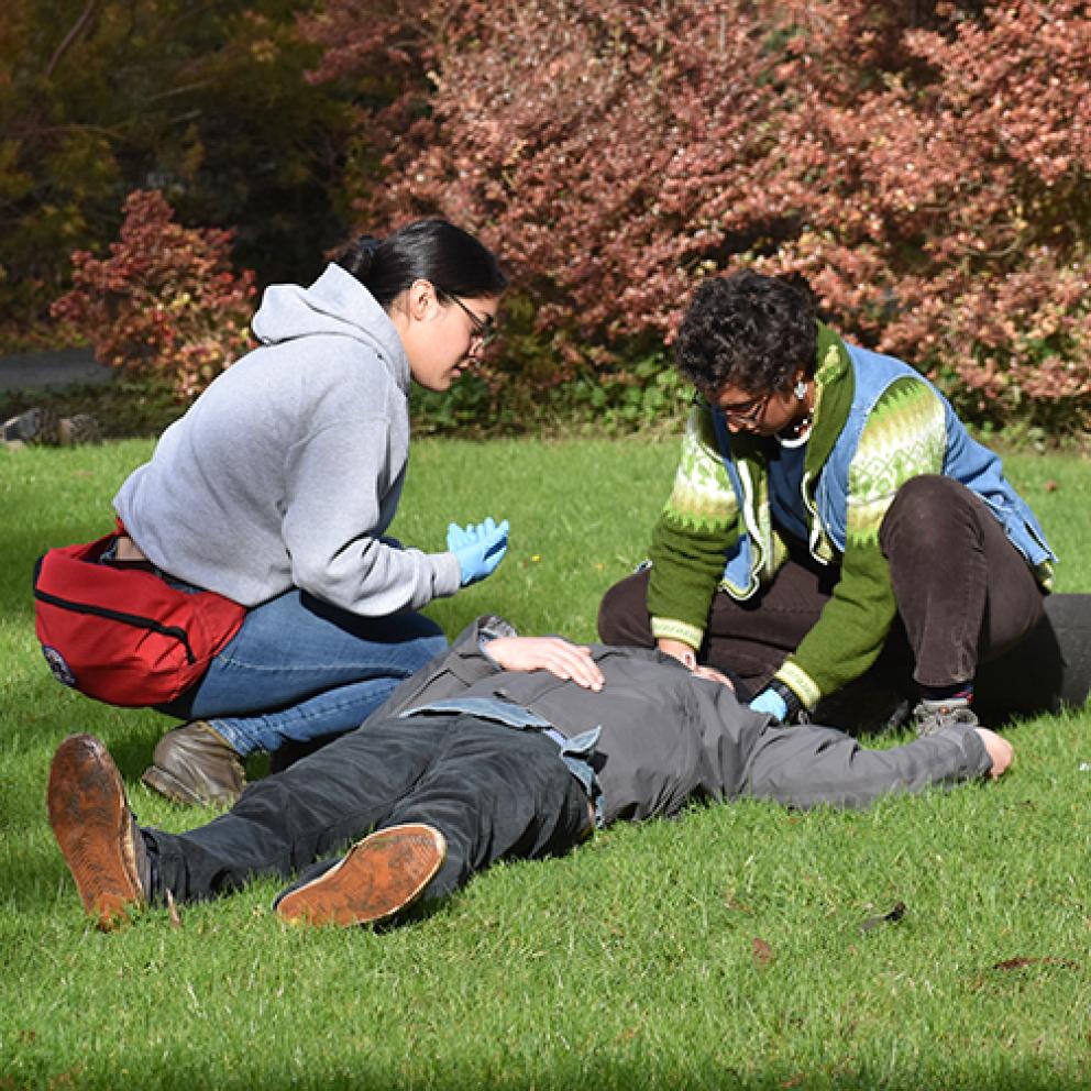 Two responders assessing patient