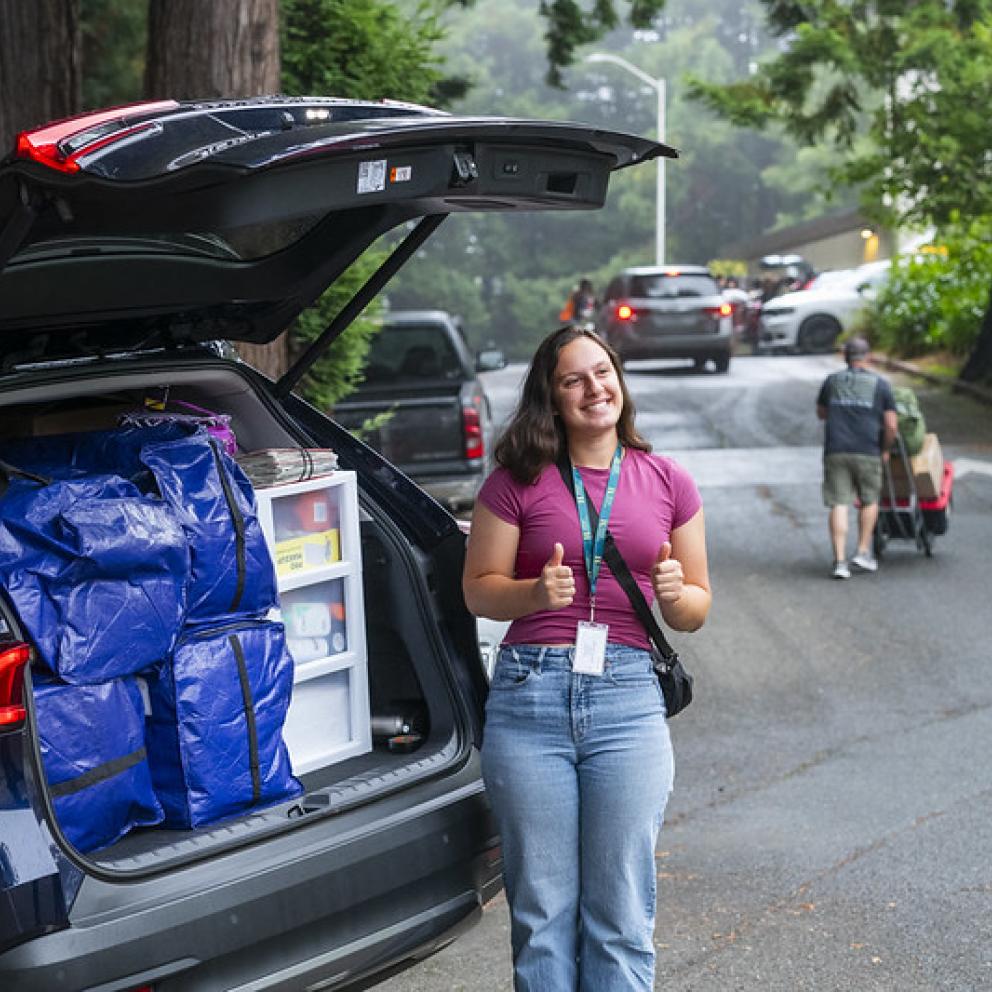 student with belongings in car, moving in