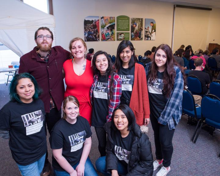 group of students hugging smiling for the camera