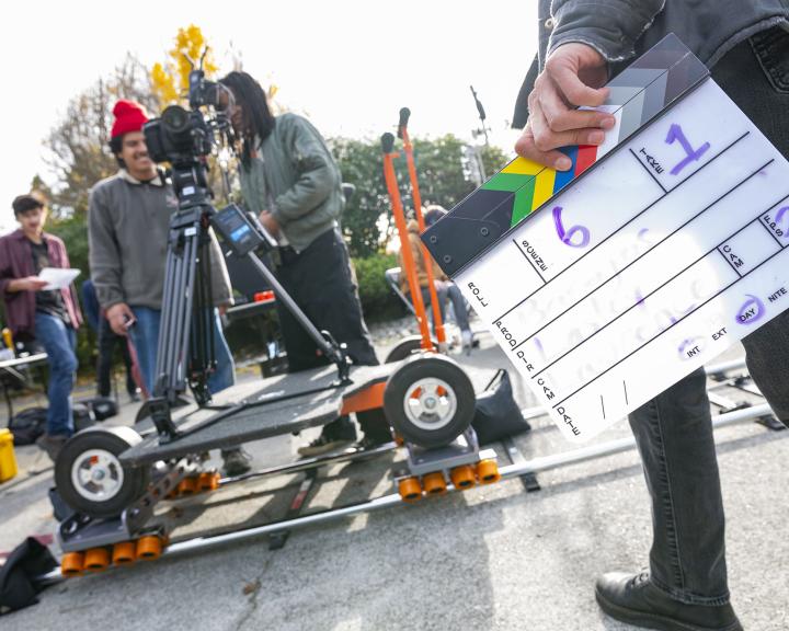 A film set outdoors with a slate in the foreground