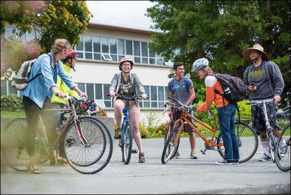 Photo of students with their bikes, ready to ride together