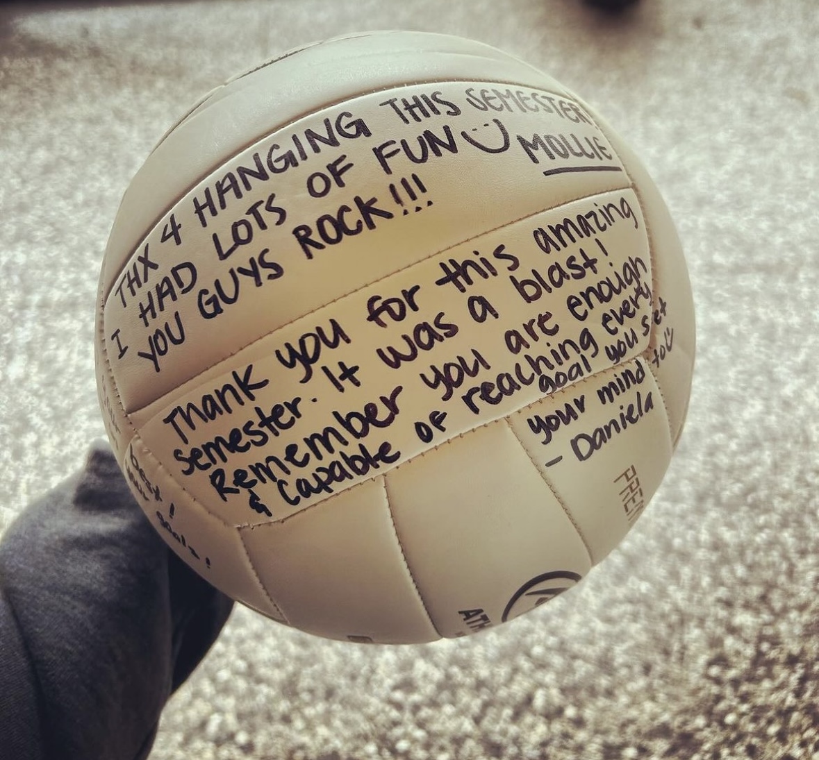 JHRP volunteers wrote messages of appreciaiton for the youth on a volleyball (S24)
